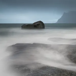 Water breaks over rocks at Uttakleiv, Lofoten Islands, Arctic, Norway, Scandinavia, Europe