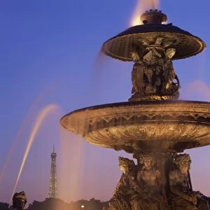 The water fountain in the Place de la Concorde with the Eiffel Tower beyond
