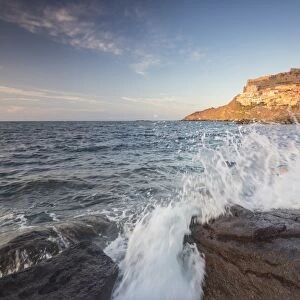 Waves of blue sea frame the village perched on promontory, Castelsardo, Gulf of Asinara
