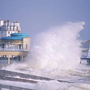 Waves pounding bandstand in a storm on the south coast, Eastbourne, East Sussex