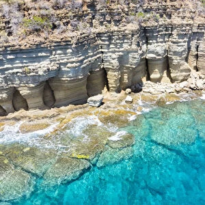White limestone cliffs Pillar of Hercules washed by Caribbean Sea, aerial view by drone