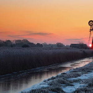 Winter sunrise over St. Benet's Mill near Thurne, Norfolk, England, United Kingdom, Europe