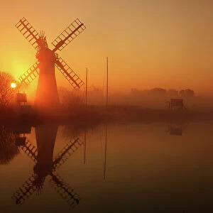Winter sunrise over Thurne Mill, Norfolk Broads, Norfolk, England, United Kingdom, Europe