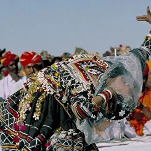 Woman dancing during desert festival