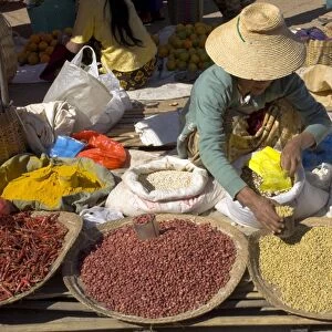 Woman selling peanuts and other pulses at local market, Kalaw, Shan State
