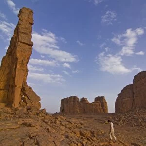 Woman walking around wonderful rock walls, Tasset, Algeria, North Africa, Africa