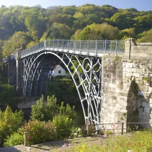 Worlds first iron bridge spans the banks of the River Severn in autumn sunshine, Ironbridge