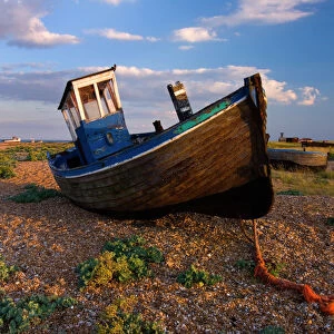 Wrecked fishing boat on shingle beach, Dungeness, Kent, England, United Kingdom, Europe
