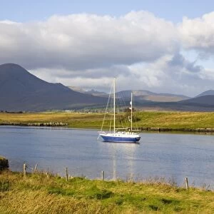 Yacht moored in inlet at Lower Breakish, near Broadford, Isle of Skye, Highland