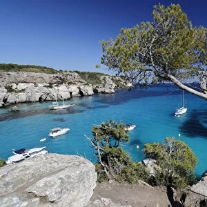 Yachts anchored in cove, Cala Macarella, near Cala Galdana, South West Coast, Menorca