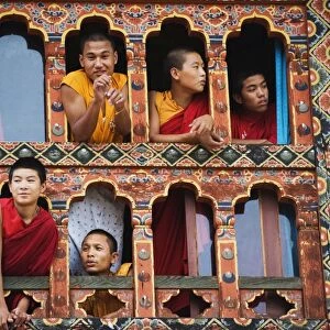 Young monks at a window, Chimi Lhakhang dating from 1499, Temple of the Divine Madman Lama Drukpa Kunley, Punakha