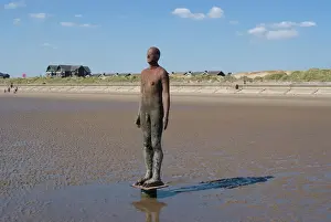 Medium Group Of People Prints: One of the 100 men of Another Place, also known as The Iron Men, statues by Antony Gormley