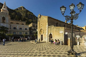 The 13th century Duomo and Piazza IX April on Corso Umberto in this popular NE tourist town, Taormina, Catania Province, Sicily, Italy, Mediterranean, Europe The 13th century Duomo and Piazza IX April on Corso Umberto in this popular NE tourist town, Taormina, Catania Province, Sicily, Italy, Mediterranean, Europe