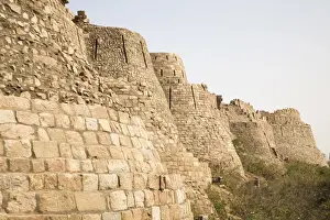 Travel Destinatio Prints: The 15 metre high curtain walls of the fourteenth century Tughluqabad Fortress in Delhi