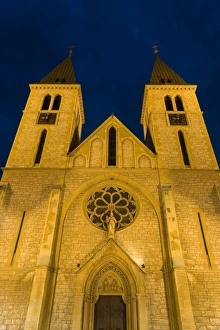 Sarajevo Prints: The 19th century Catholic cathedral illuminated at dusk, Bascarsija district