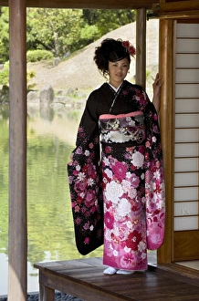 Images Dated 29th April 2009: A 20-year old Japanese girl wearing spring furisode kimono with long sleeves to indicate her