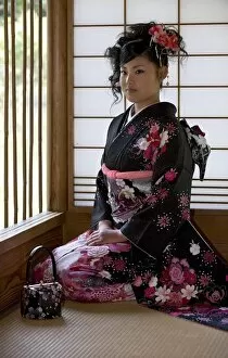 Images Dated 29th April 2009: A 20-year old Japanese girl wearing spring furisode kimono with long sleeves to indicate her