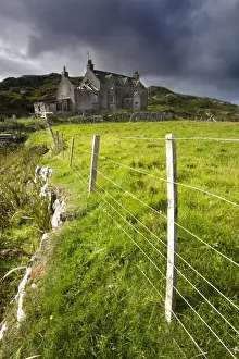 Manish Prints: Abandoned croft beneath a stormy sky in the township of Manish on the east coast of The Isle of Harris