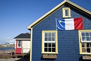 Images Dated 18th September 2009: Acadian flag on blue house in La Grave, Ile Havre-Aubert, one of the Iles de la Madeleine
