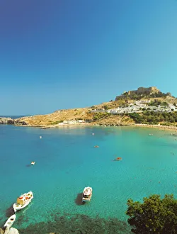 Acropolis overlooking bay, Lindos, Rhodes, Dodecanese, Greek Islands, Greece, Europe
