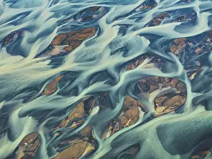 Outdoor Exploration Prints: Aerial abstract view taken by drone of the textured river along the Icelandic southern coast
