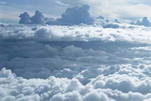 Weather Prints: Aerial of banks of puffy white clouds seen from the air