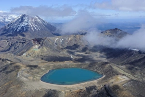 Aerial of a blue lake with Mount Ngauruhoe in the background, Tongariro National Park, UNESCO World Heritage Site, North Island, New Zealand, Pacific