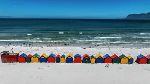 Summery Prints: Aerial of the colourful beach huts on the beach of Muizenberg