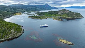 Aerial of a cruise ship anchoring in Wulaia Bay, Tierra del Fuego, Chile, South America