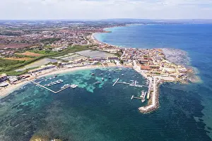 Fishing Boat Prints: Aerial drone shot of the fishing village of Marzamemi in blue water