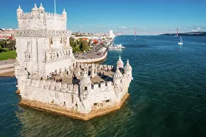 Aerial drone view of Belem Tower, a 16th-century fortification located in Lisbon, Portugal on the Tagus River