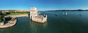 Aerial drone view of Belem Tower, a 16th-century fortification located in Lisbon, Portugal on the Tagus River