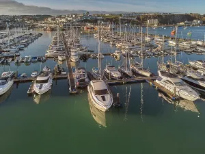 Watercraft Prints: An aerial drone view of boats moored in the marina at Brixham