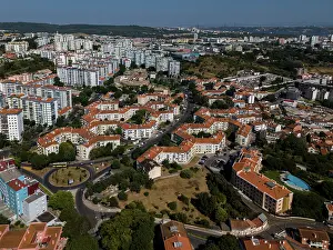 Lisbon Prints: Aerial drone view of geometric Soviet-era apartment blocks in Carnaxide district in Lisbon
