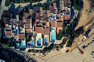 Swimming Pool Prints: Aerial drone top down view of luxurious residences in Vale do Lobo