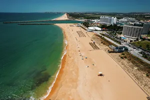 Aerial drone view of Praia de Vilamoura in Vilamoura, looking west, Algarve, Portugal, Europe