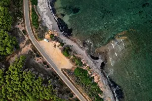 Overhead Prints: Aerial drone view above view of camper van with solar panels on Sardinia coast