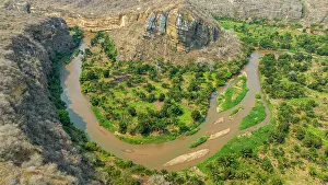 Angola Prints: Aerial of the horseshoe bend of the Rio Cubal Canyon, Angola, Africa