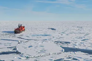 Aerial of the Icebreaker 50 years of victory on the North Pole through the window of a helicopter