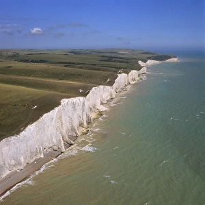 White Cliffs Prints: Aerial image of the chalk cliffs of the Seven Sisters, with Belle Tout lighthouse