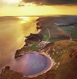 View From Above Prints: Aerial image of Lulworth Cove, a natural landform harbour, near West Lulworth