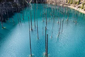 Aerial of the Kaindy Lake with its dead trees, Kolsay Lakes National Park, Tian Shan mountains, Kazakhstan, Central Asia, Asia