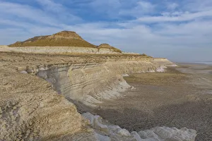 Aerial of massive rock cliff, Sor Tuzbair, a solonchak (salt marsh), Mangystau, Kazakhstan, Central Asia, Asia