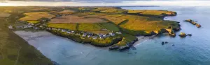 Aerial panorama of Porthcothan Bay and rugged Cornish coastline at dawn, Cornwall