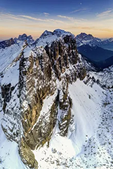 Monte Pelmo Prints: Aerial panoramic of majestic Nuvolau, Monte Pelmo and Civetta covered with snow at sunset