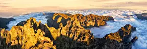 Solar Flare Prints: Aerial panoramic of Pico das Torres and Pico do Arieiro mountains in a sea of clouds