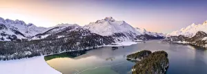 Aerial panoramic of Piz Da La Margna and Lake Sils during a winter sunrise, Engadine