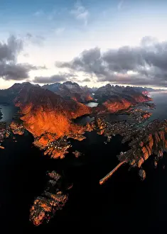 Lofoten Islands Prints: Aerial panoramic view of the coastal village of Tind framed by mountains at sunset