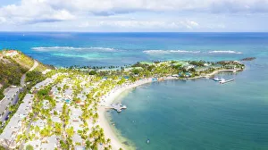 Overcast Prints: Aerial panoramicby drone of palm-fringed beach, St. James Bay, Antigua, Leeward Islands
