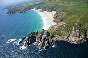 West Penwith Prints: Aerial photo of Treen Cliff and Porthcurno beach looking west to the Minnack Theatre